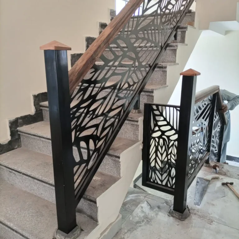 Steel staircase railing with leaf pattern