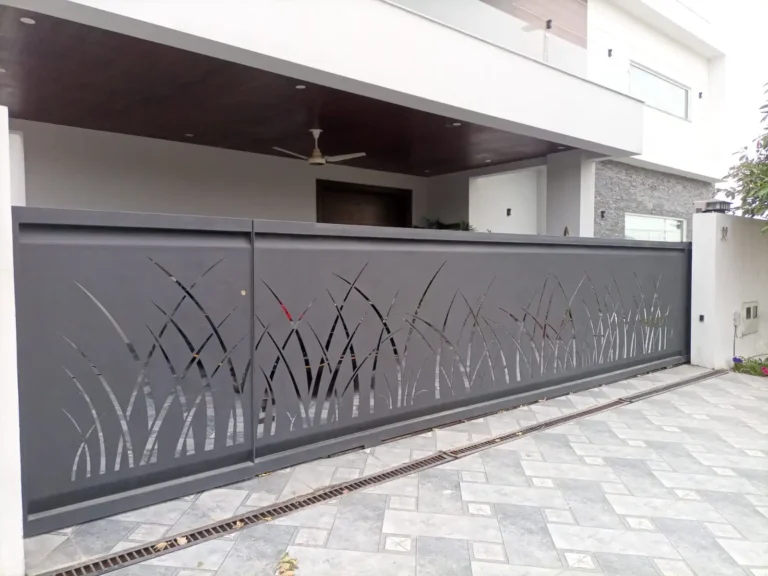 Grey steel sliding gate with a grass pattern cut-out