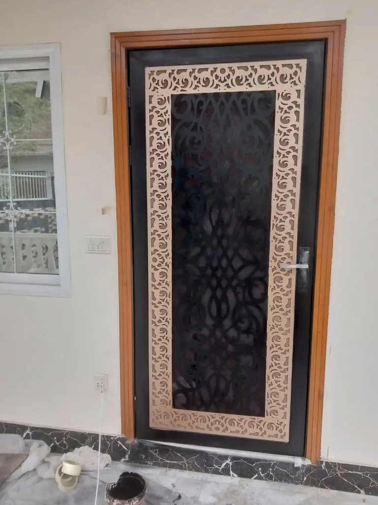 Steel door with laser-cut decorative panel