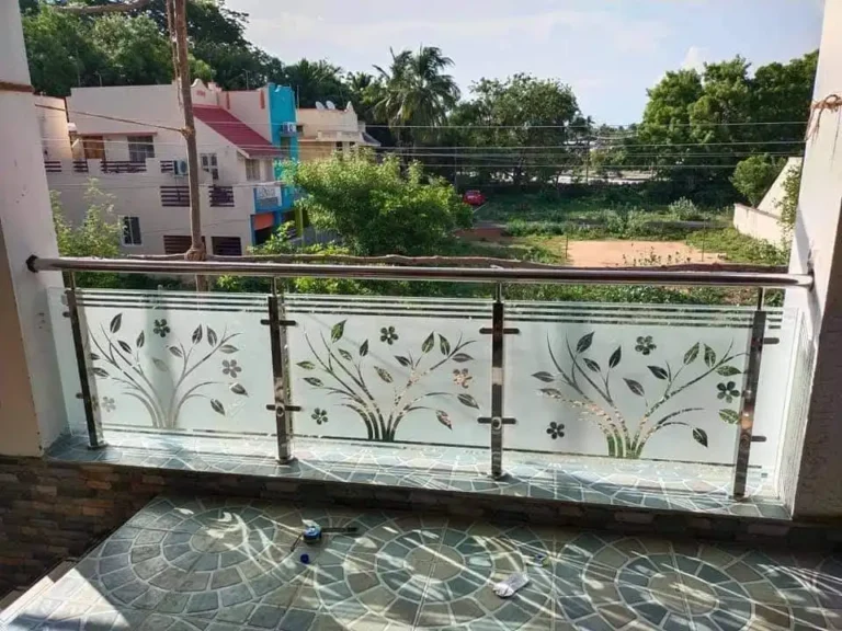 Glass balcony railing with steel posts